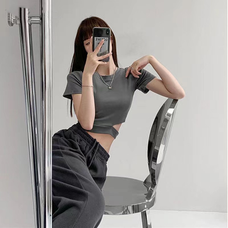 甜辣妹不规则开叉露腰短袖t恤女夏纯色圆领缕空短款t恤女外贸批发