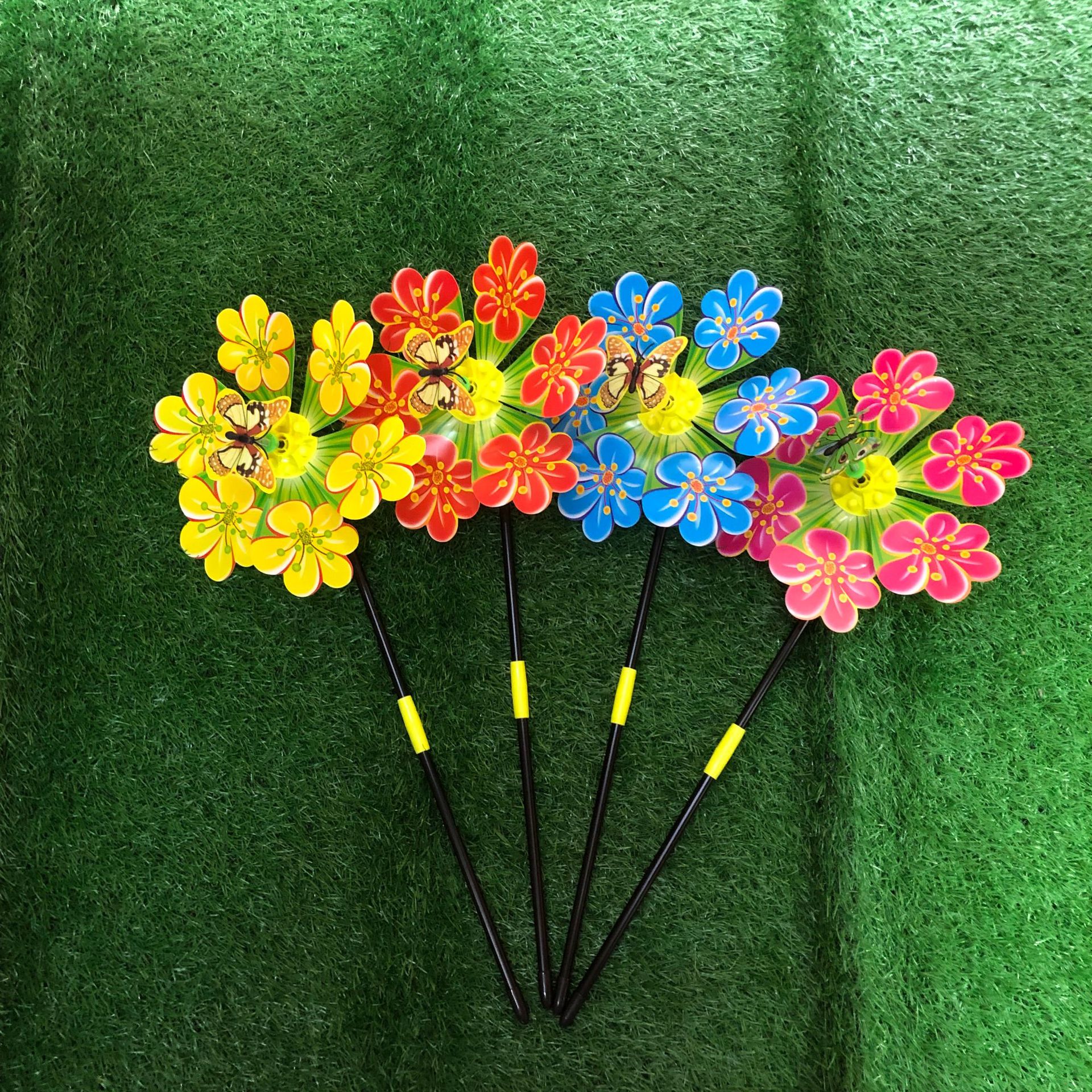 Factory Hot New Plum Windmill Outdoor Decoration Garden Environmental Protection Spring Four-Color Hand Holding Pinwheel