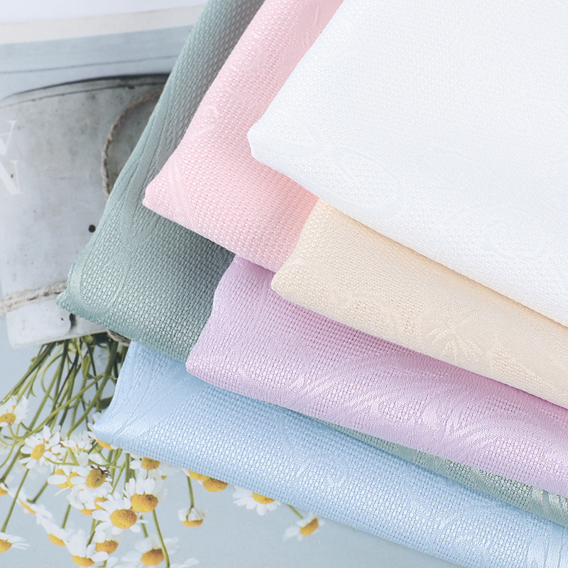 115g仿花罗汉服旗袍面料 春夏新品多花型睡莲镂空提花布料 现货