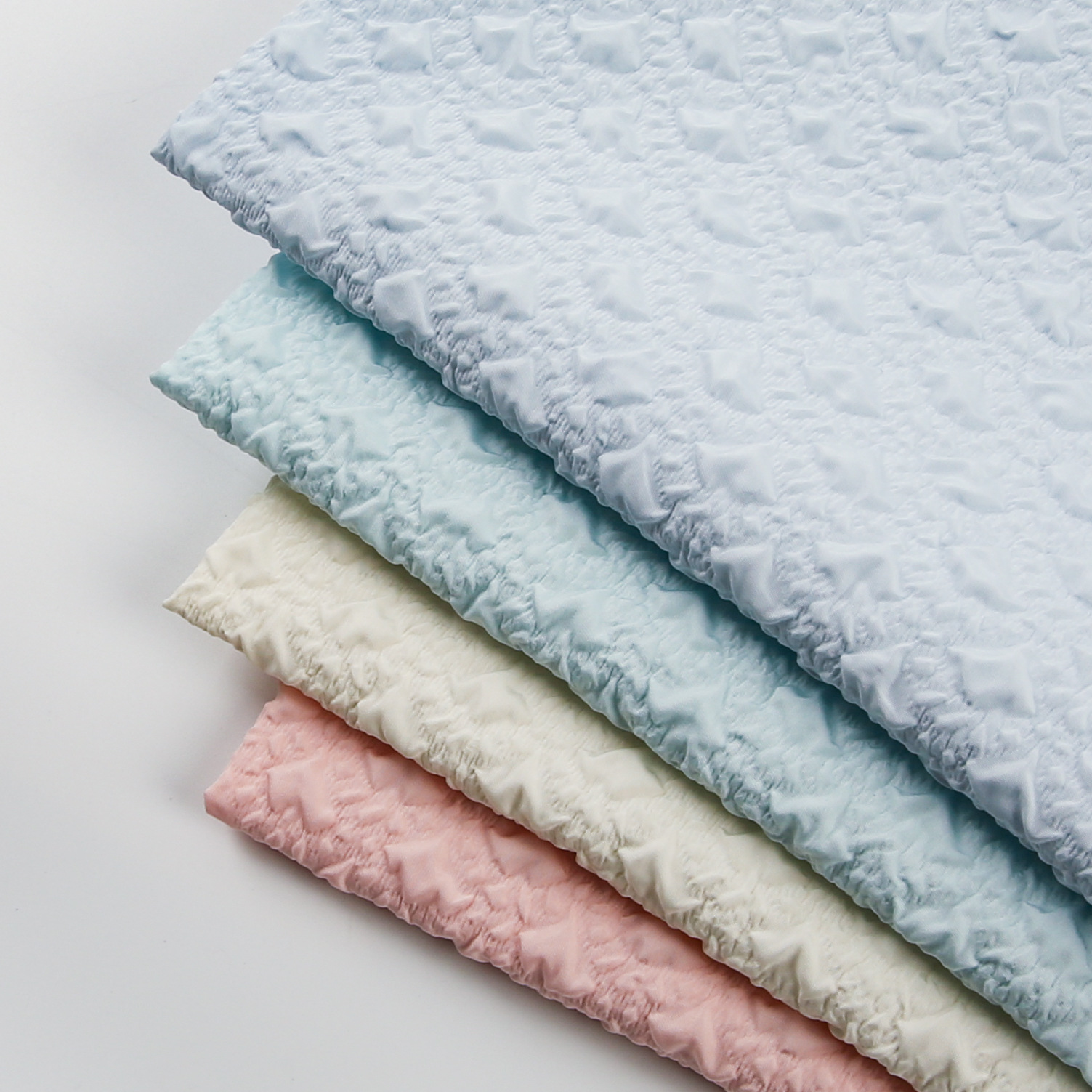 新款现货涤纶压花压绉面料 3d立体压绉泡泡 春夏童装裙子鞋帽布料