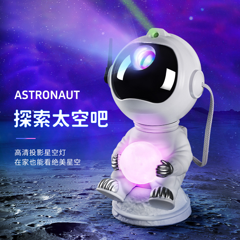 Cross-Border New Arrival Sitting Astronaut Starry Sky Projection Lamp Sitting Style Holding the Moon Ambience Light Computer Desktop Gift Decoration