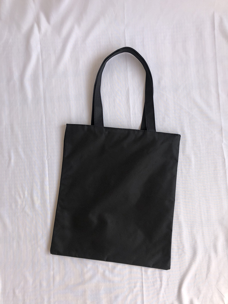 简约时尚帆布包女黑色单肩包男印花手提袋背包大容量购物帆布袋