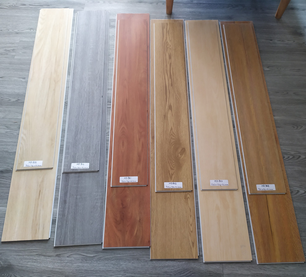 广东厂家出口石塑spc锁扣地板 工程仿木纹免胶塑料地板砖佛山批发