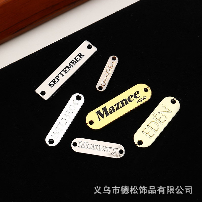 Hot Selling Zinc Alloy Clothing Logo Metal Plate Customized Die-Casting Rectangular Concave-Convex Letter Perforated Metal Tag