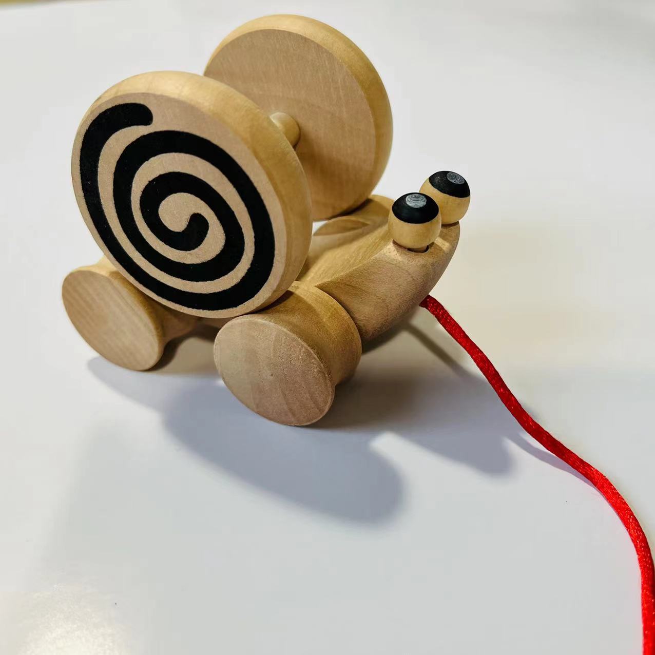 蜗牛拉车漩涡轮子幼儿园宝宝手工diy转圈小车跨境木制儿童玩具129