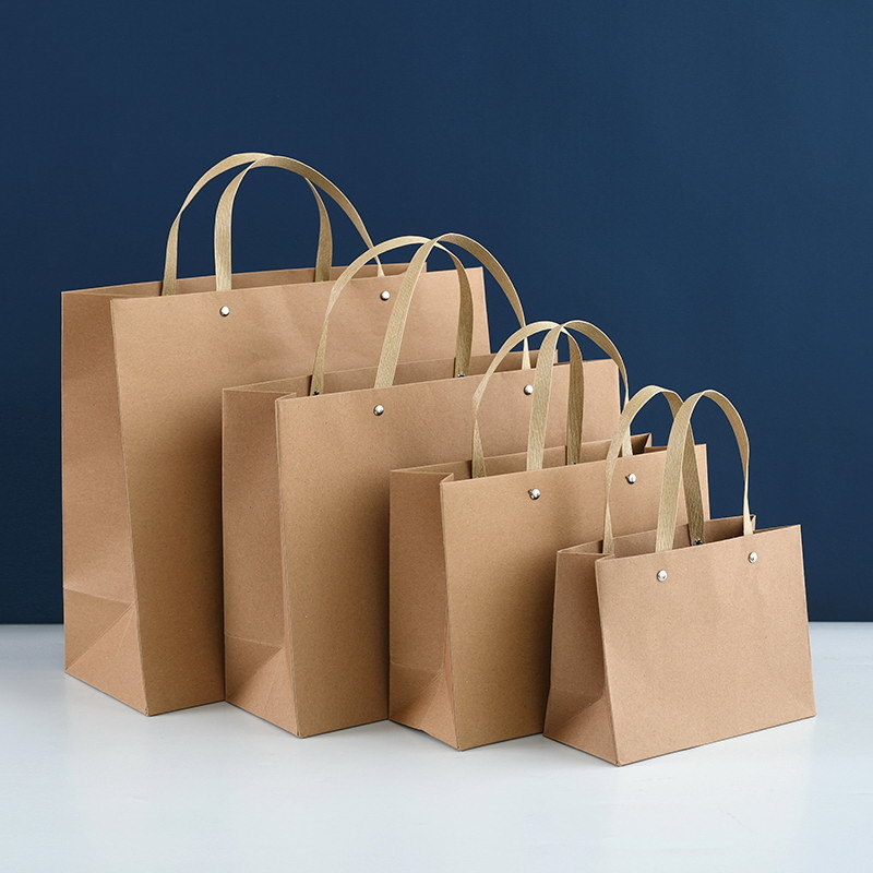现货铆钉牛皮纸袋购物袋260g高克重礼品包装时尚手提袋服装袋批发