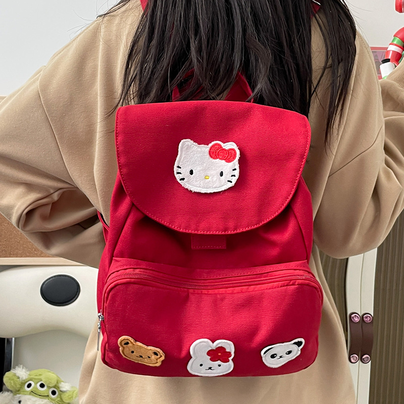 韩版休闲背包大容量简约纯色帆布学生书包日系可爱KT猫双肩包批发