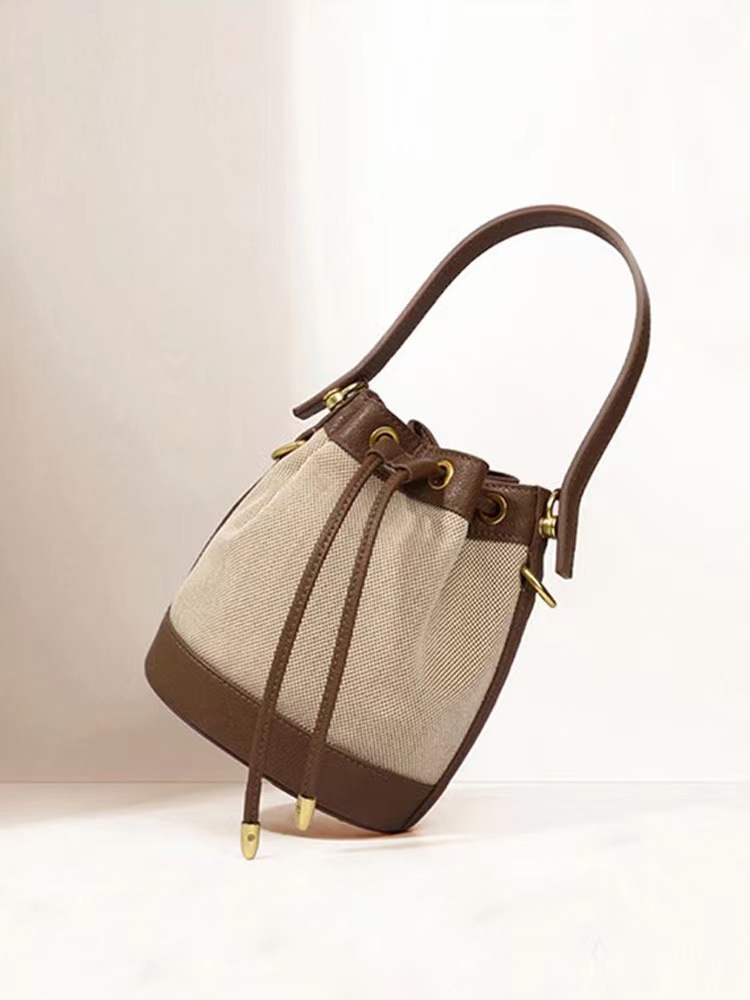 包包女2023新款小众设计水桶包简约复古单肩斜挎包手提小包女拼接