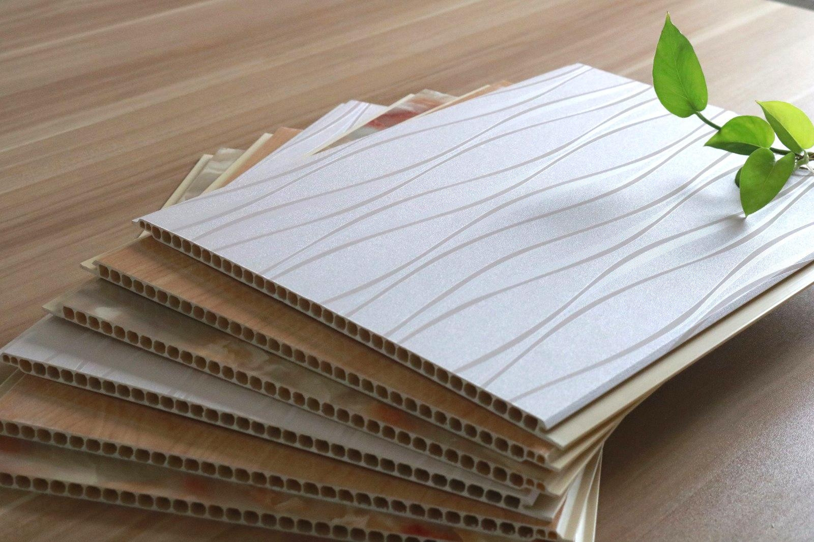 热卖工厂直发300 600宽pvc竹木纤维墙板 家装酒店办公石塑饰面板