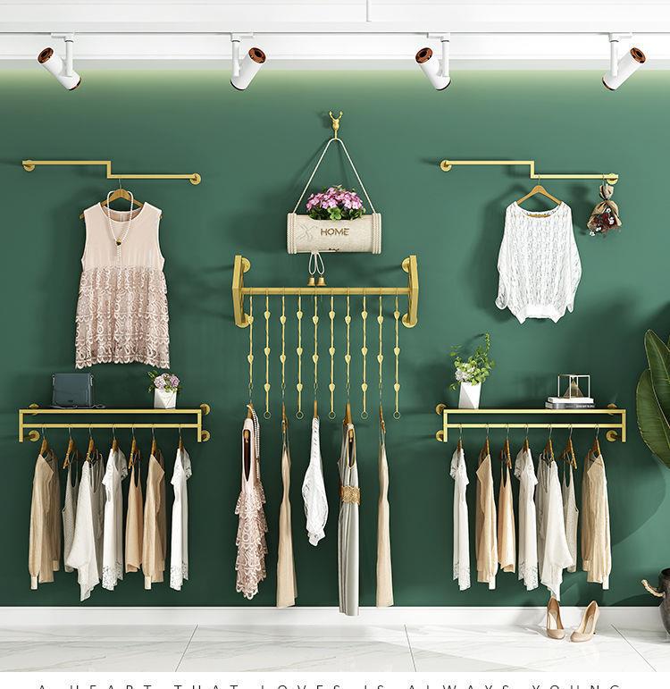 男女童服装店展示架上墙壁挂式店铺陈列货架金色挂衣服的架子墙上