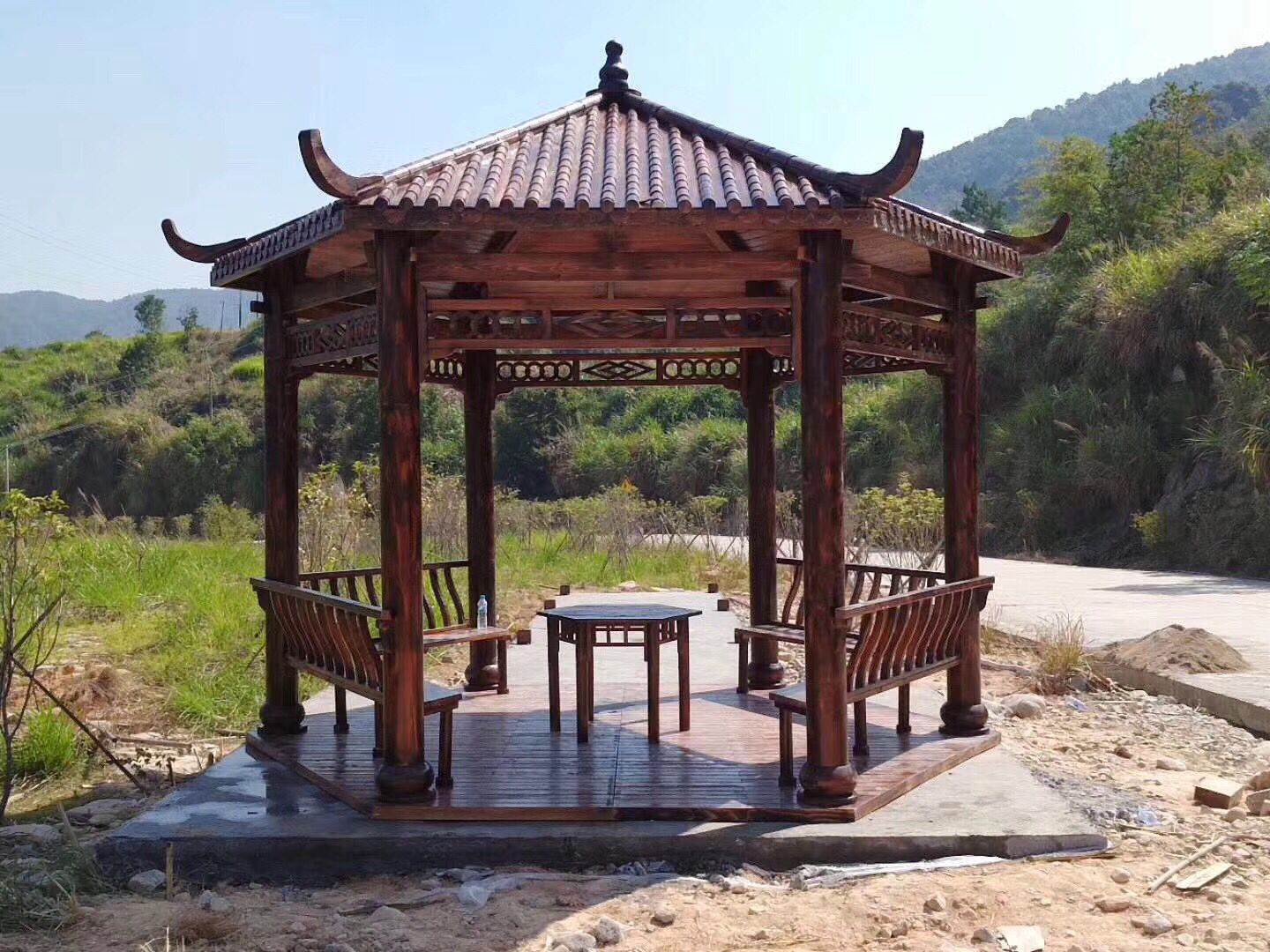 凉亭厂家直销碳化木防腐木庭院木屋户外实木亭子六角仿古原木质亭