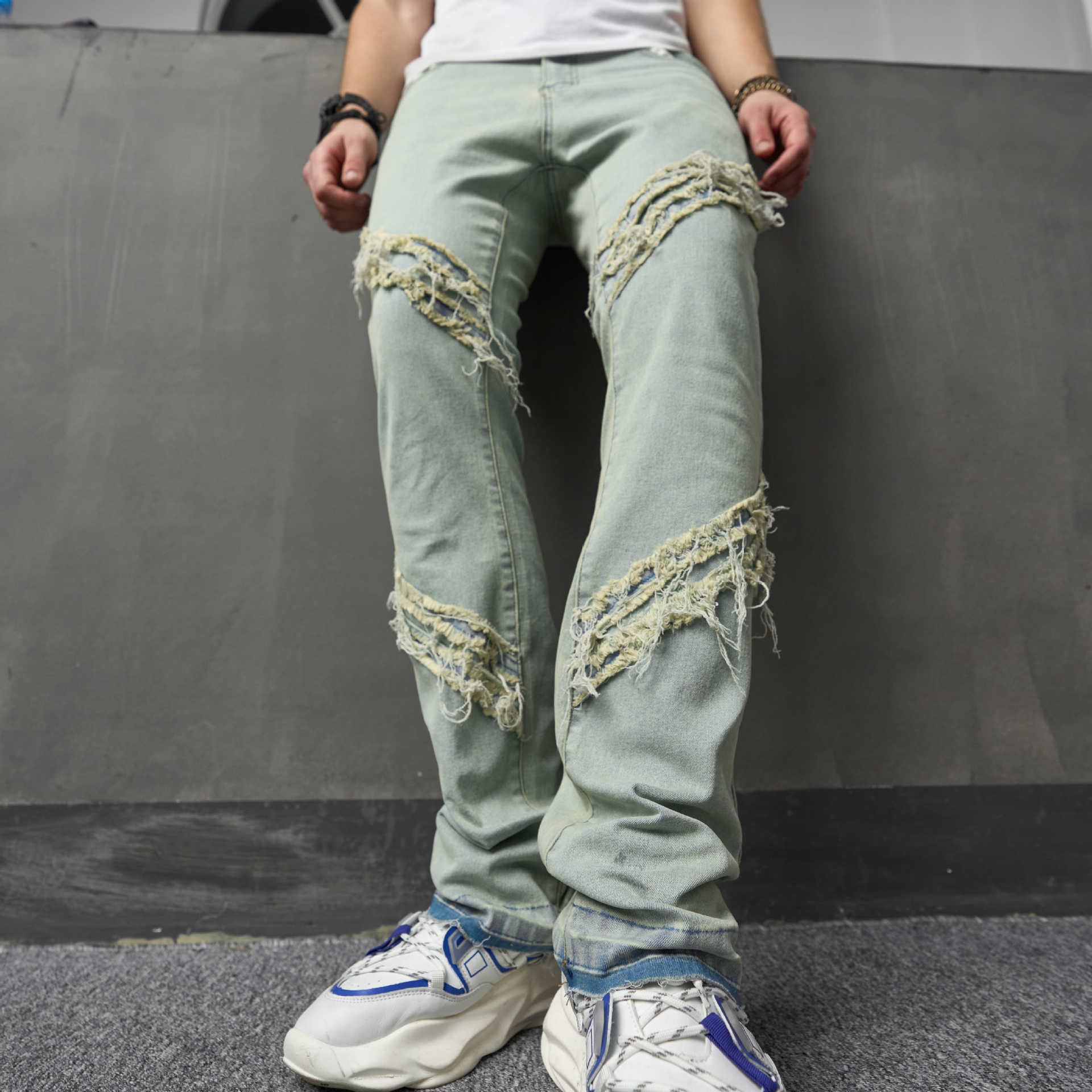 跨境外贸美式高街时尚男士牛仔裤拼接毛边设计感潮弹力修身微喇裤