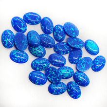 厂家批发蛋形平底素面op05蓝色澳宝椭圆形火彩人造欧泊宝石的裸石