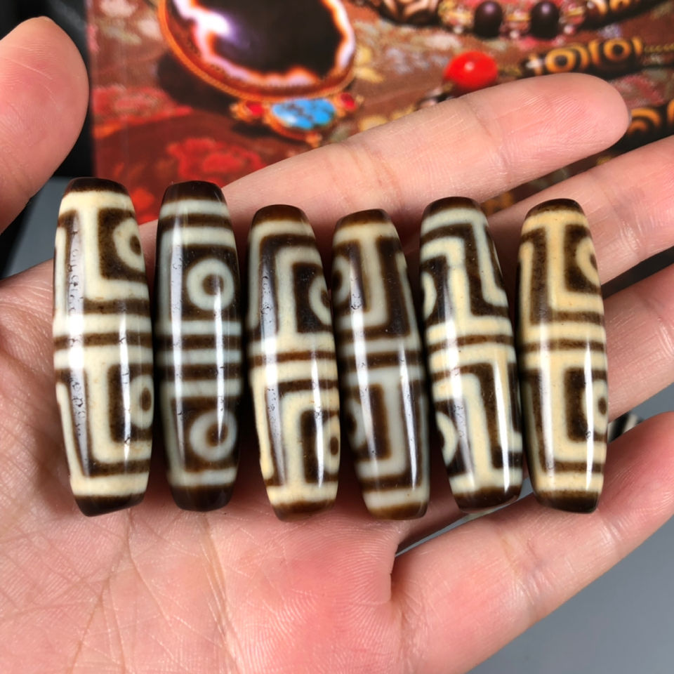 西藏天珠火供四眼天珠牙黄色老天珠寓意消除遭难减轻痛苦好-阿里巴巴