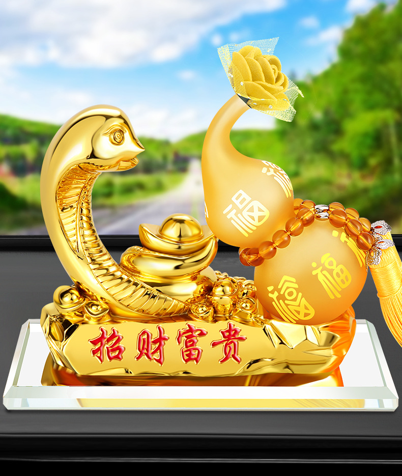 【产品款式】:金蛇纳福【产品材质】:树脂 水晶底座【产品名称】:金蛇