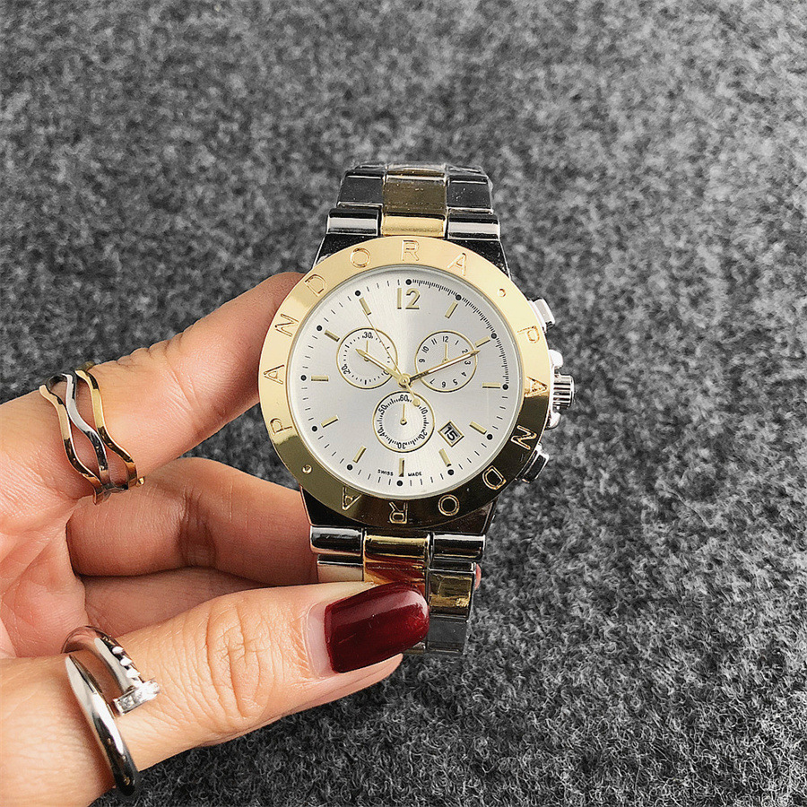 江湖地摊货源热卖金手表时尚dw英伦情侣表运动表三眼装饰手表