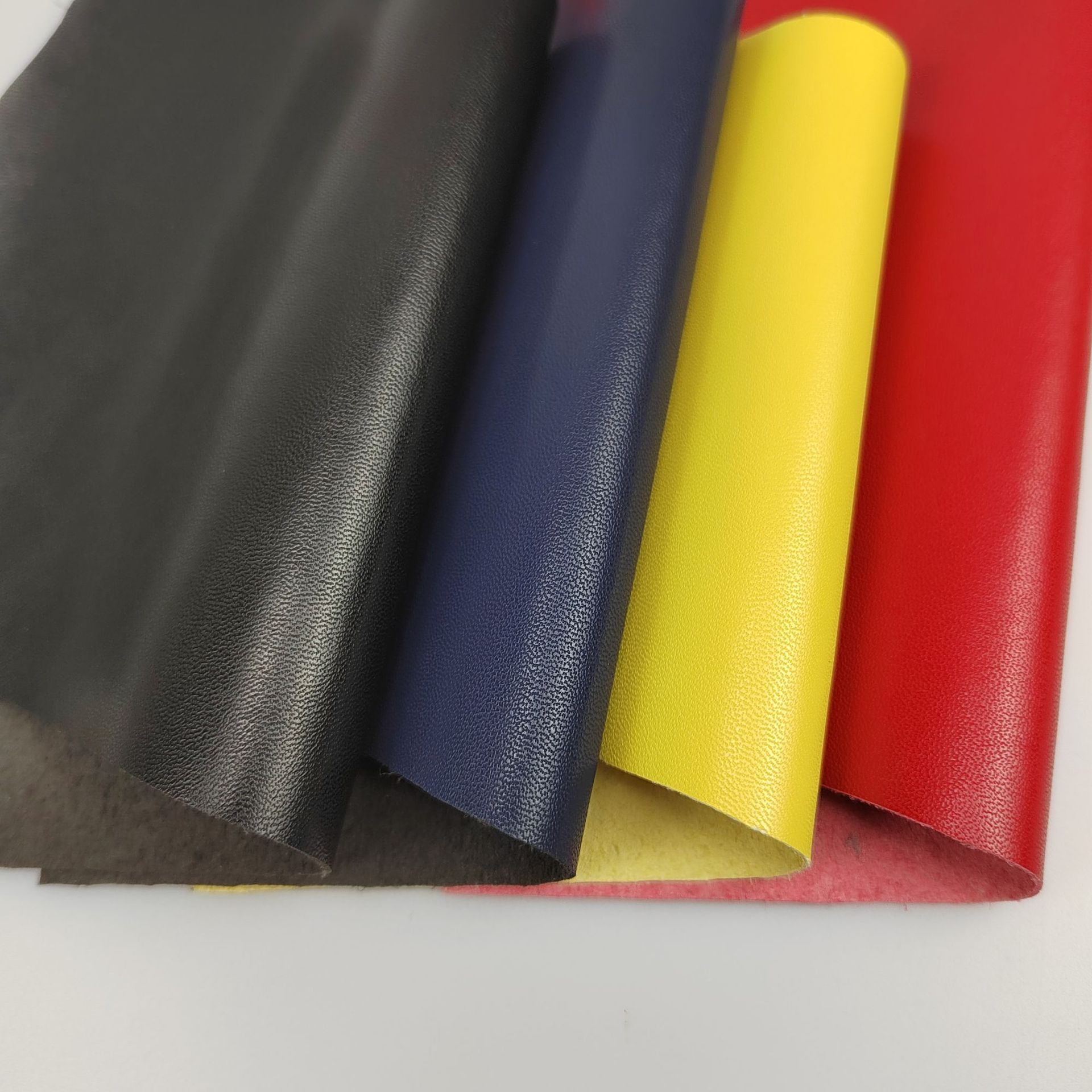 现货批发仿皮小羊皮纹贴合超纤细纹0.6厚鞋材箱包家具坐垫汽车革