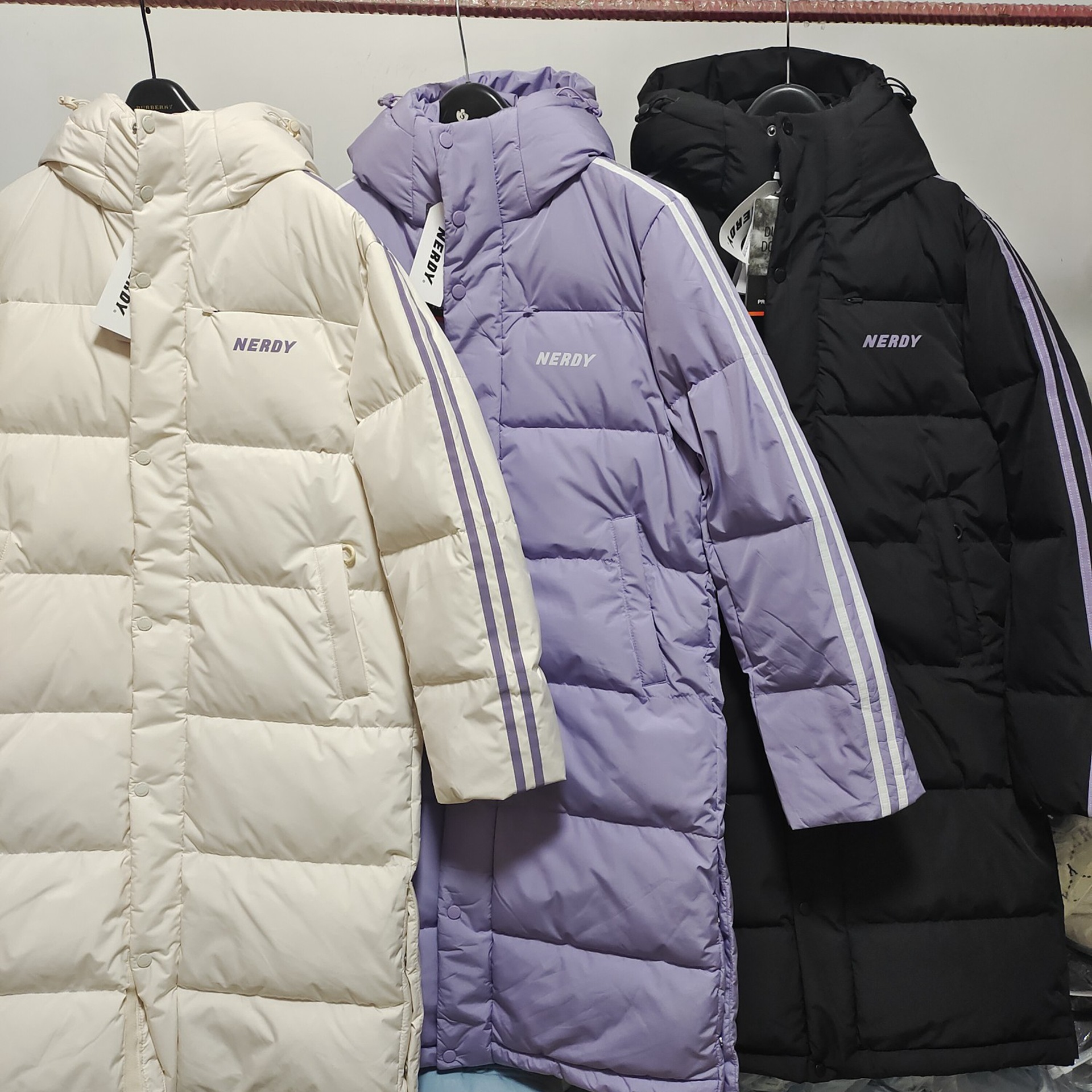 新款nerdy反光条男女情侣长款过膝加厚休闲宽松连帽白鸭绒羽绒服