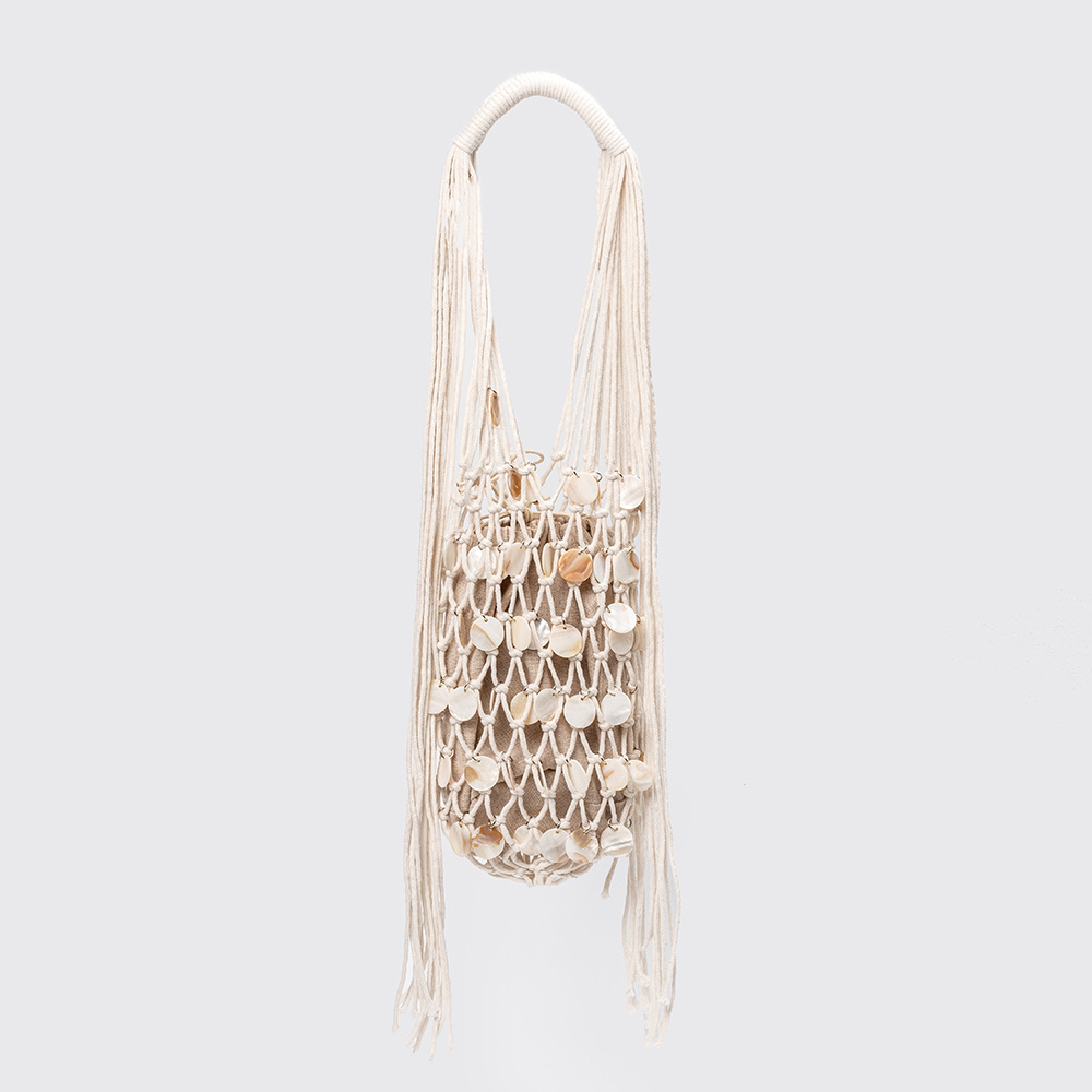 Shell-pattern casual shoulder bag, relaxed style, mesh bag, handmade woven bag, women's European and American cross-border vacation tote bag.