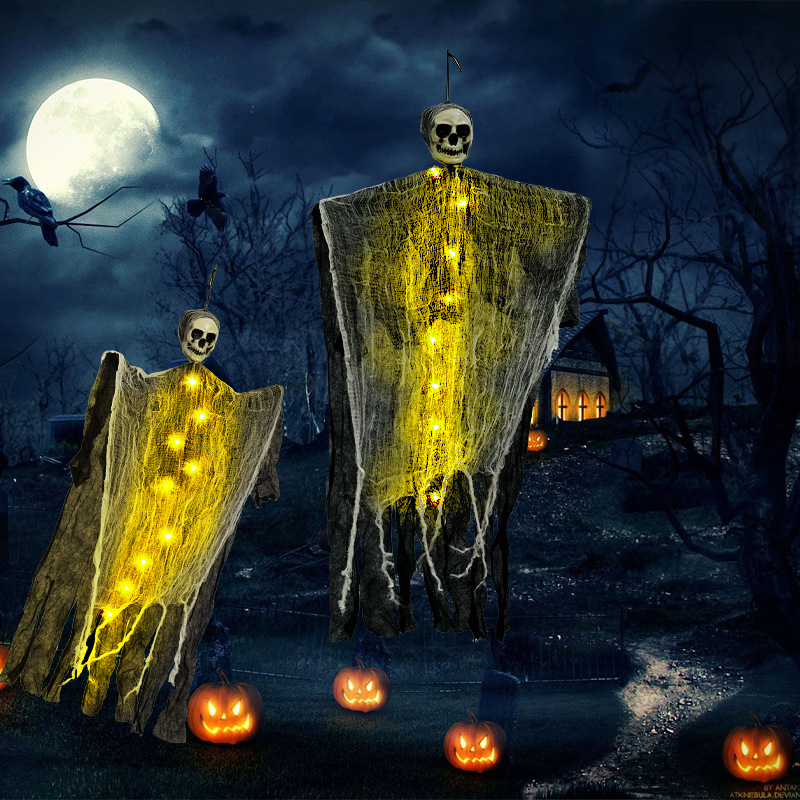 Halloween party decorations: colorful warm light, flying ghosts, skulls, hanging ghosts, porch and front door decorations.