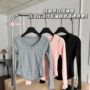 Autumn and winter new simple fashion V-neck solid color slim slim hem irregular design women's long sleeve bottoming shirt