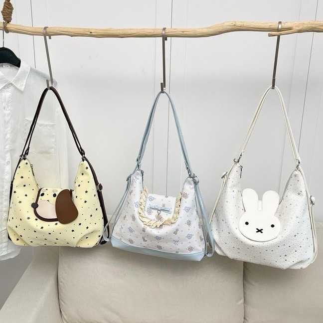 Cute cartoon Miffy rabbit backpack with star-studded design, unique style, sweet bow, playful shoulder/crossbody bag.