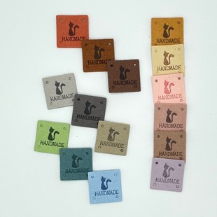 Color label handmade with hole cat embossed suede leather label hat handmade bag children's clothing clothing label