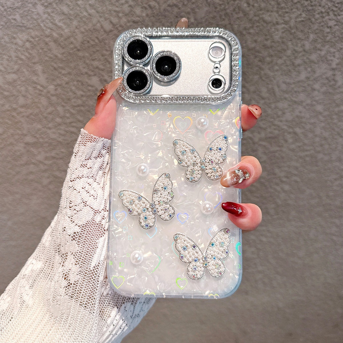 Luxury shell-patterned phone case with pearl and butterfly design for iPhone 17 Pro Max, suitable for Apple 16, protective case for women.