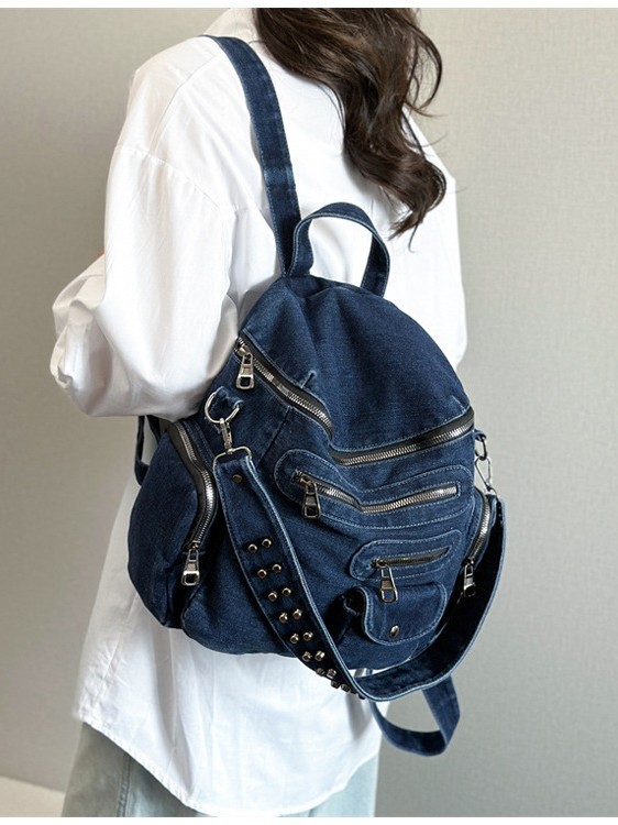 Washed denim backpack with studs, versatile for college students, suitable for commuting and back-to-school season.
