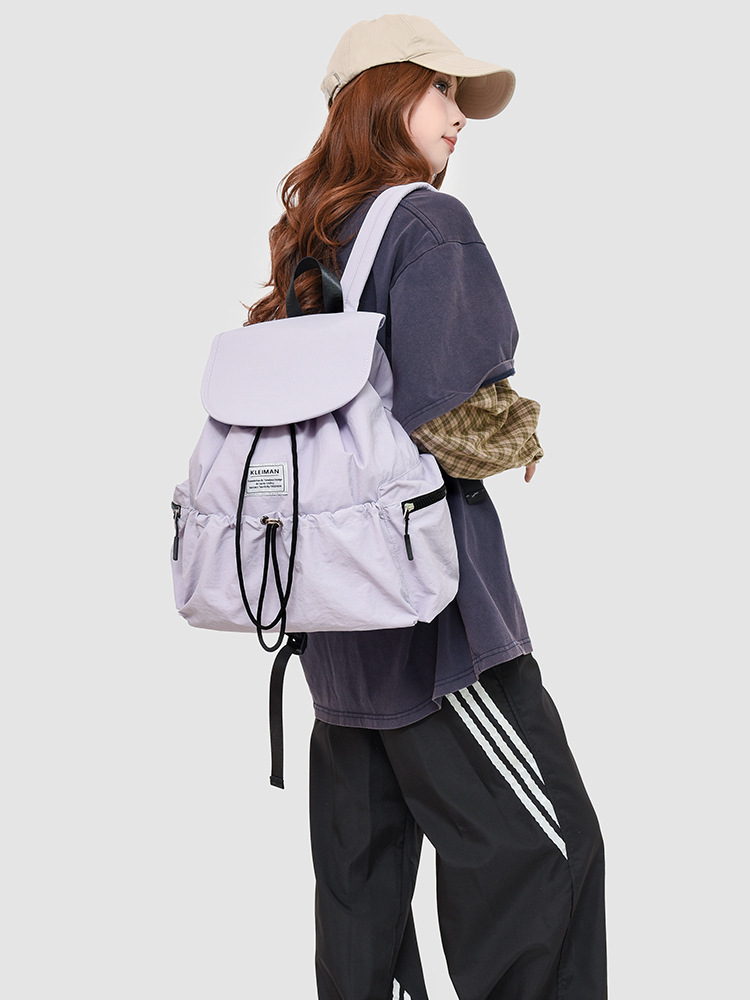 New Japanese and Korean style casual backpack, large capacity, drawstring flap, lightweight travel backpack.
