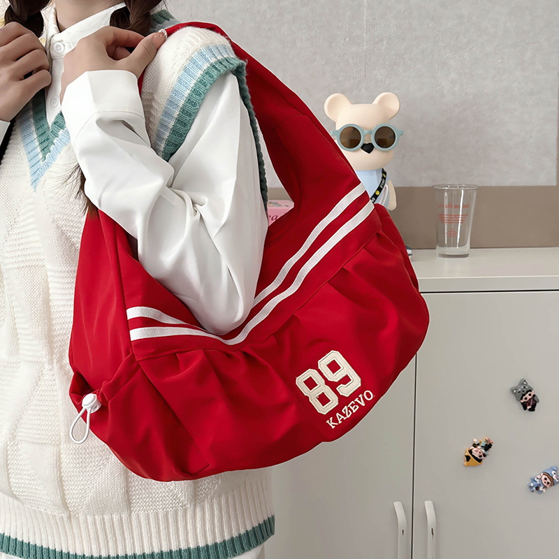 New export style casual striped pleated canvas women's commuter handbag with cloud embroidery, featuring underarm design.