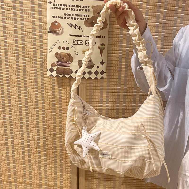 Girl's drawstring dumpling bag, versatile, suitable for students, commuting, shoulder bag, shopping, travel, lightweight crossbody bag, Korean niche brand.