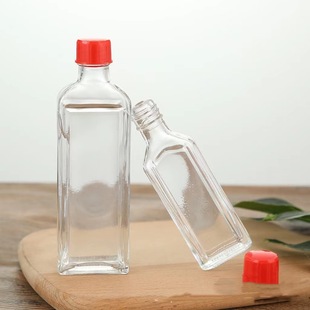 Wholesale transparent glass wind oil bottle medical filling live oil bottle/safflower oil bottle and matching sealed bottle cap