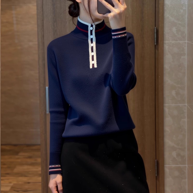 2026 winter new collection: French-style stand-up collar knitted top for women, featuring a deep blue color with contrasting trim, designed to be slimming, age-reducing, and exuding elegance