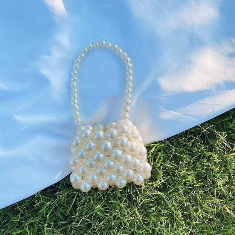 Pearl-embellished mini handbags for children, cute crossbody bags for girls.