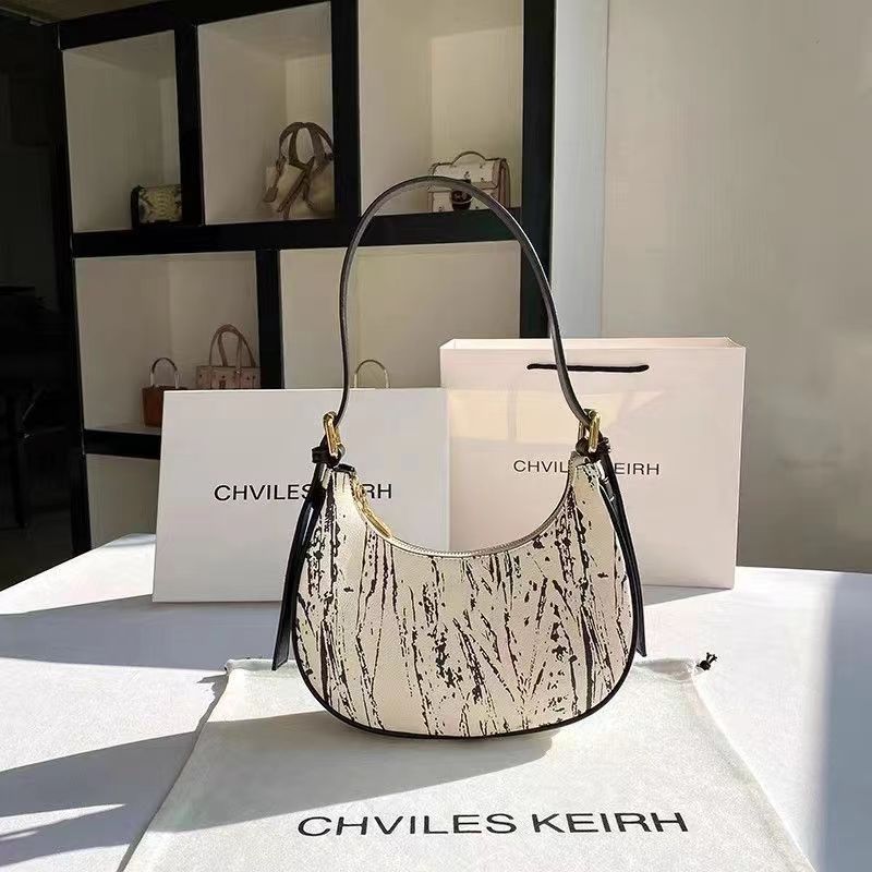 Women's handbag, niche design, crescent moon bag, 2023 new style, versatile baguette style, underarm bag.