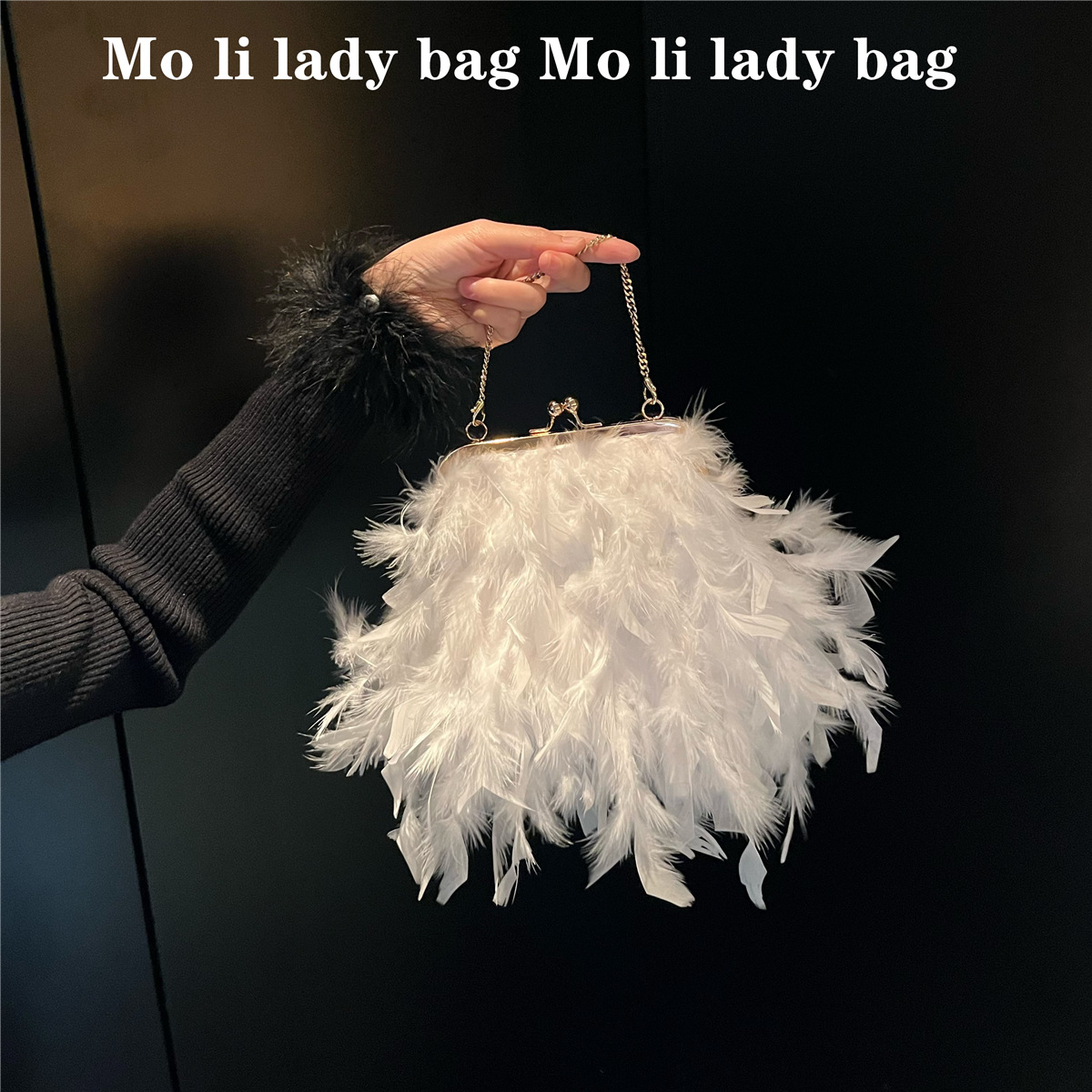 Elegant handmade ostrich feather bag with chain for evening wear, perfect for Fall/Winter 2024, featuring a pearl fairy design.