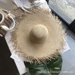European and American style spring and summer new hand-woven raffia grass big rough Mori women's straw hat beach travel all-match concave modeling hat