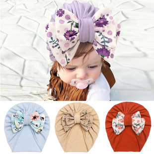 2023 European and American autumn new children's artificial cotton knotted hat baby printed bow pullover hat baby hat