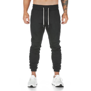 Muscle new men's solid color fitness pants European and American sports pants running training feet pants wholesale