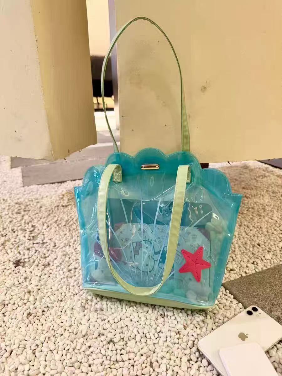 High-value transparent PVC seashell shoulder bag, new summer style, waterproof, perfect for women's travel, beach, and other outdoor activities.