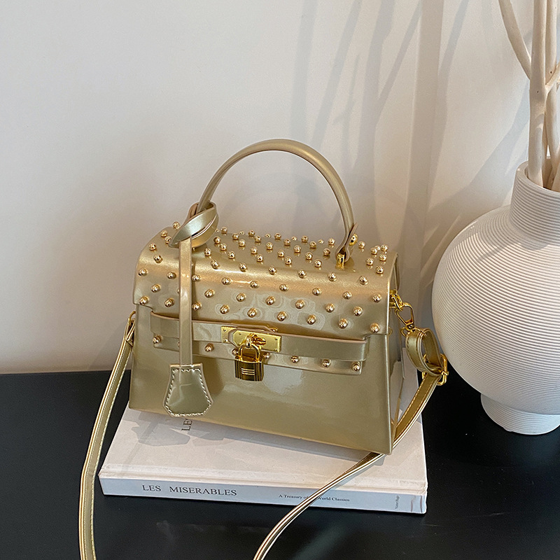 Glossy studded buckle Kelly handbag for women, high-end, light luxury, retro style, trendy shoulder/crossbody bag.