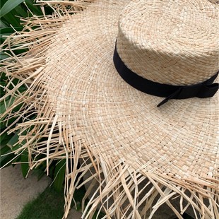 Factory summer vacation wind flat top wide ribbon rough eaves seaside sunshade modeling Lafite straw hat wholesale