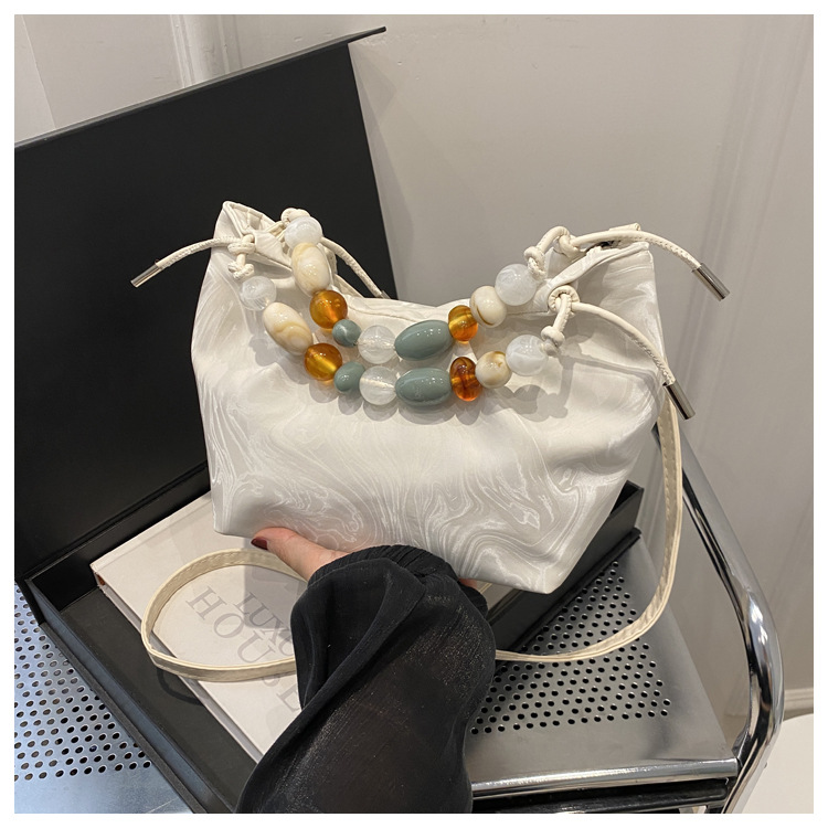 New Chinese style women's handbag, 2025 summer fashion niche bucket bag, versatile pearl crossbody bag.