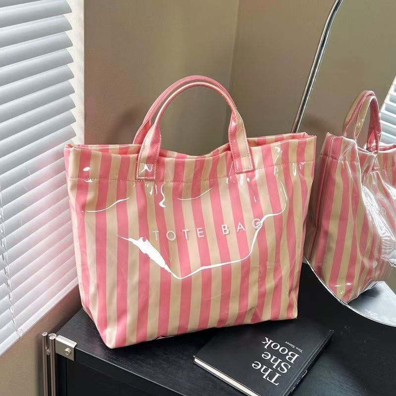 Large capacity DuPont paper jelly bag, stylish transparent PVC waterproof tote bag for work commuting, diaper bag, trendy.