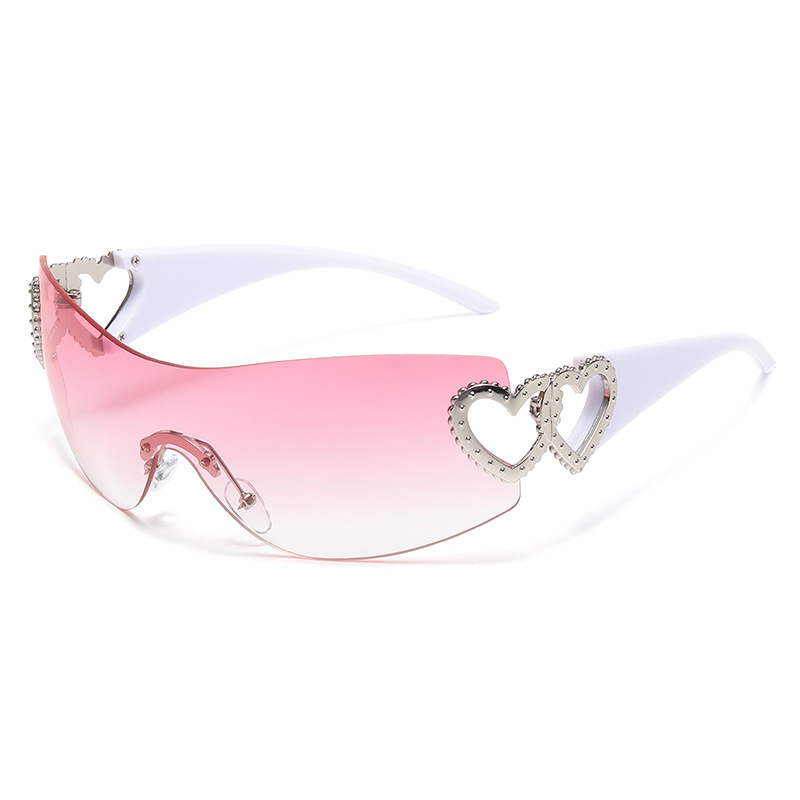 Trending European and American style heart-shaped frameless Y2K sunglasses for men and women, perfect for street style and fashion.