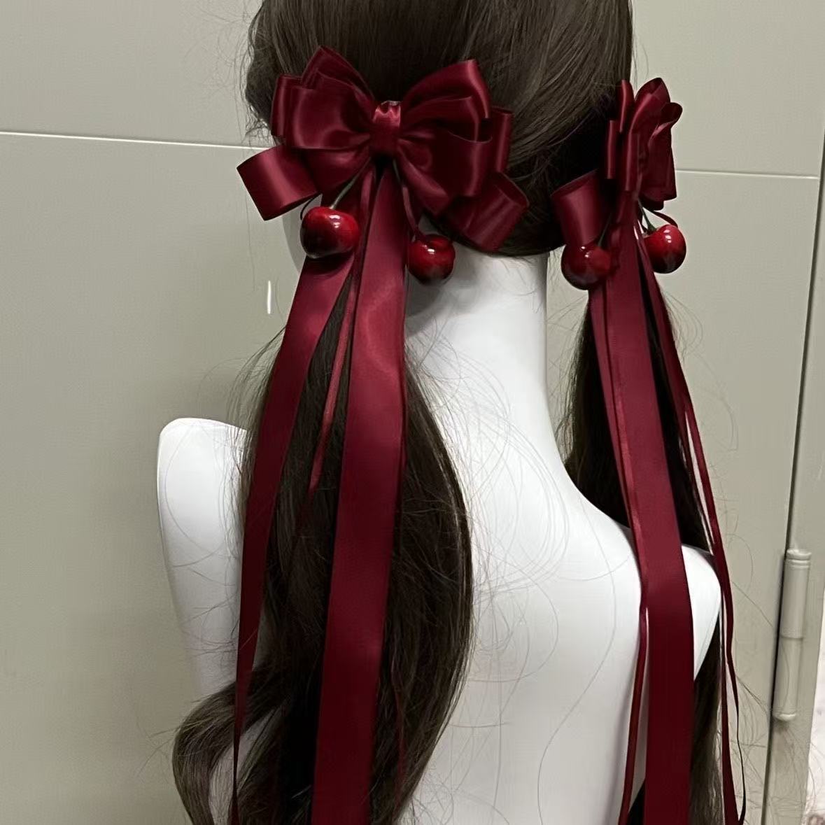 Burgundy satin cherry bow hair accessory, a must-have for Japanese JK soft girl style double ponytails with ribbon clips.