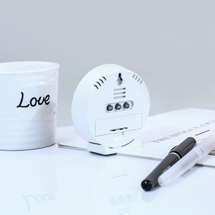 Cross-border hot selling household electronic temperature and humidity meter round desktop appearance exquisite multi-purpose temperature and humidity meter