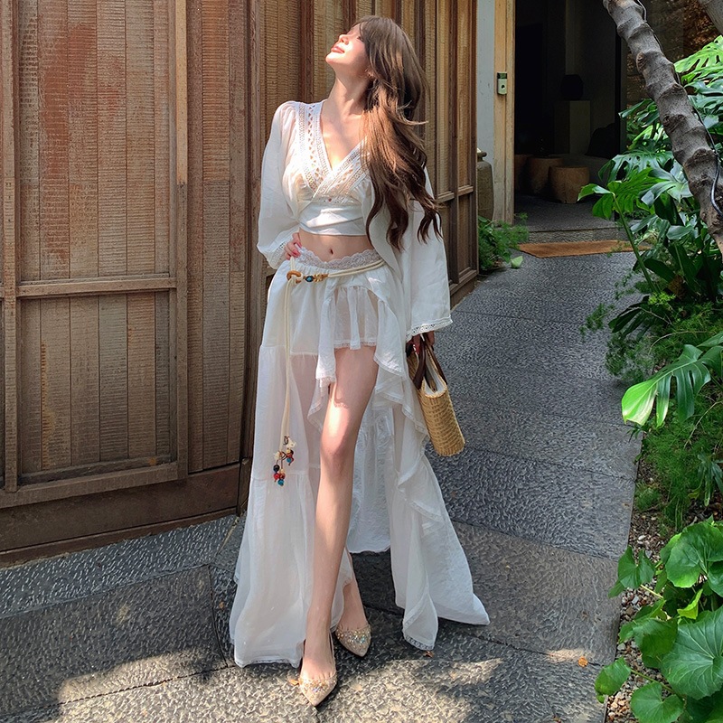 Island Resort Style Fairy Lace Patchwork Flared Sleeve White Top with Embroidered Irregular Flowing Skirt Set