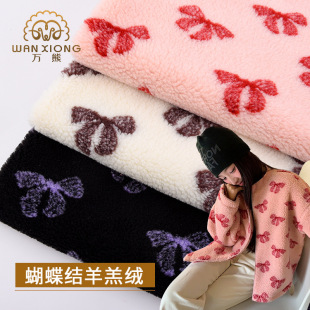 In stock wholesale Bow Jacquard lamb wool fabric printed lamb wool lamb wool autumn and winter coat fabric